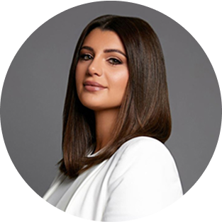 Jessica Kashro, Creative Director at Perceptiv Media, portrait in professional attire against a grey background.