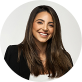 Rachelle Sassine smiling in professional attire, representing AI SEO services in Sydney for enhanced digital marketing strategies.
