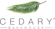 Cedary Bakehouse logo featuring a stylized green leaf above the brand name in elegant black font, representing a fresh and natural approach to baked goods.