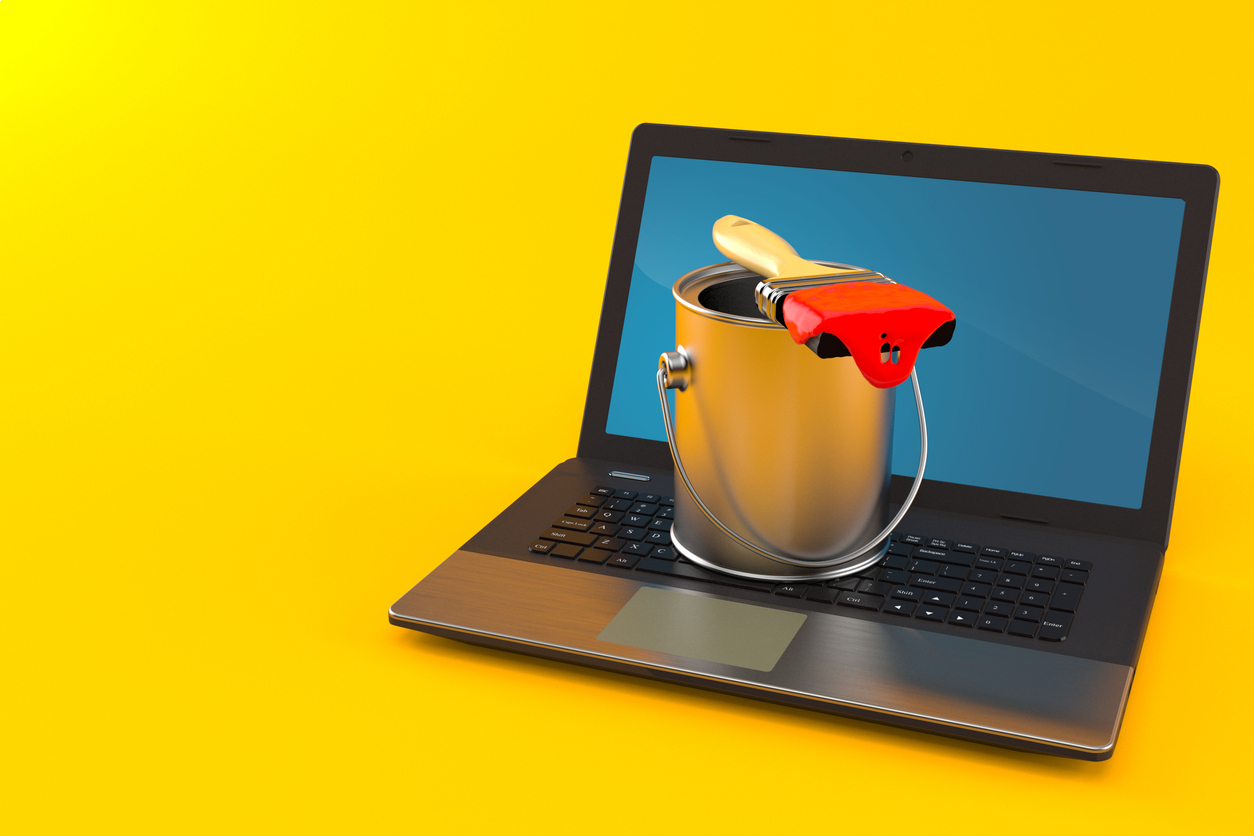 Laptop with a paint can and brush, symbolizing digital marketing strategies for painters in Australia.